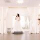 three brides in stunning wedding dresses in front of bridal lounge areas