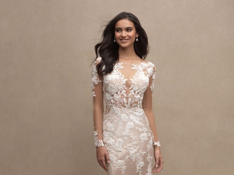 the Cara gown by Allure Couture, an exquisite dress with lace detailing.