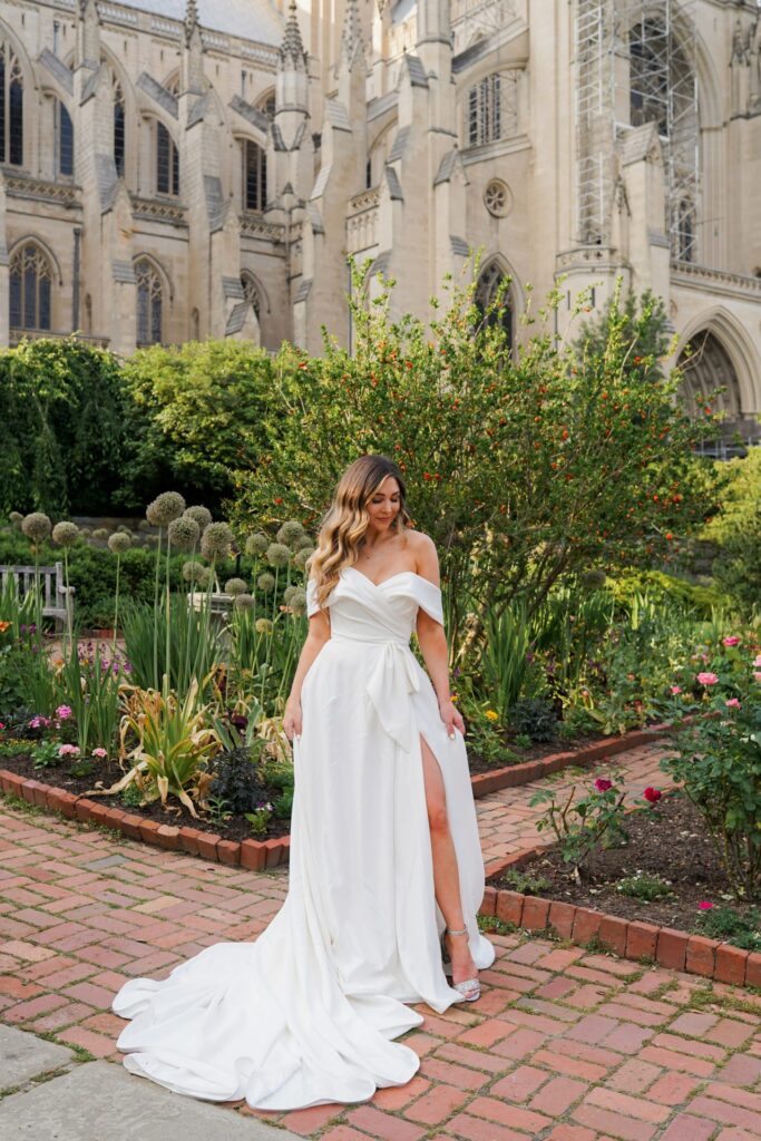 woman in stunning minimalist dress in front of a cathedral