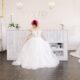 bride with pink and black hair wearing a beautiful wedding dress at Vivid Bridal Boutique