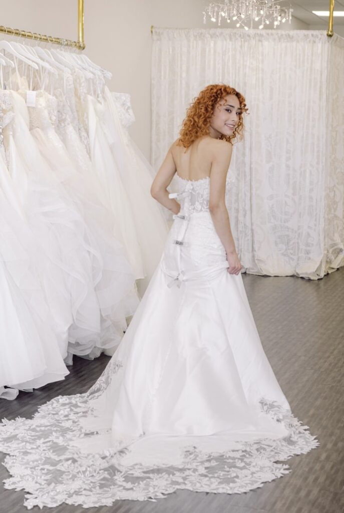bride at Vivid Bridal Boutique wearing a wedding dress with clips